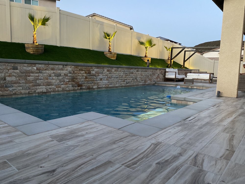 Enhancing your Backyard Pool with Landscaping and Lighting